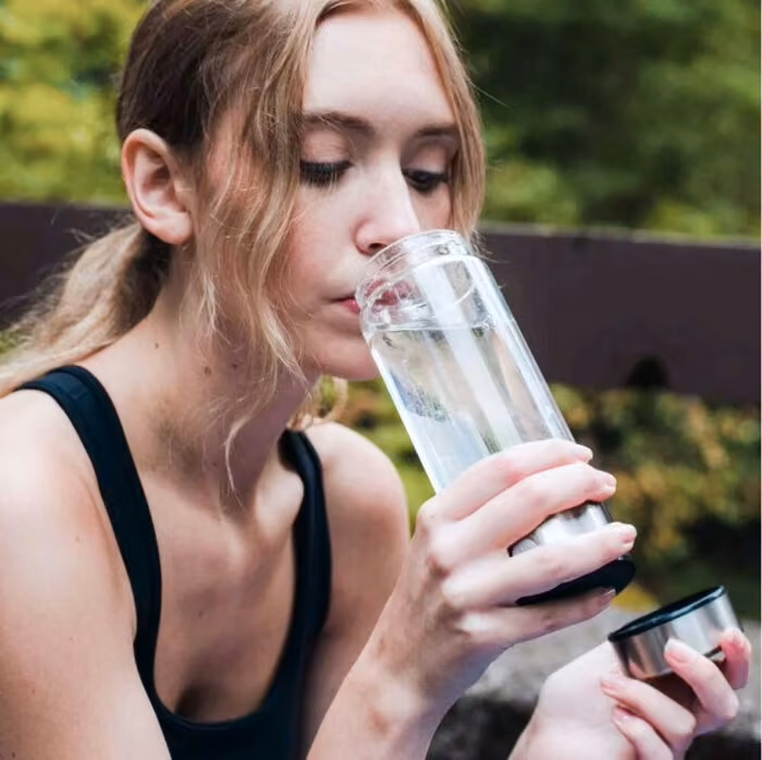 Aquivor bottle used outdoors, an eco-friendly lifestyle